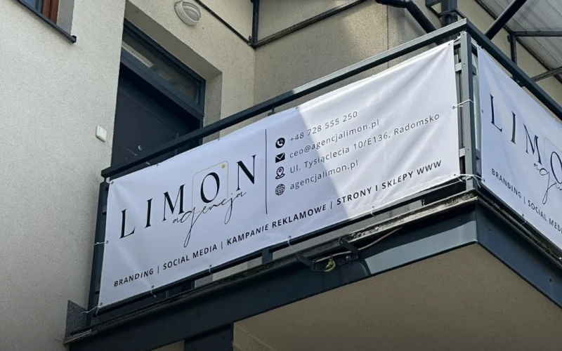 Baner agencji Limon na balkonie z widocznymi danymi kontaktowymi Baner reklamowy agencji Limon zawieszony na balkonie budynku, na banerze dane kontaktowe i oferta agencji